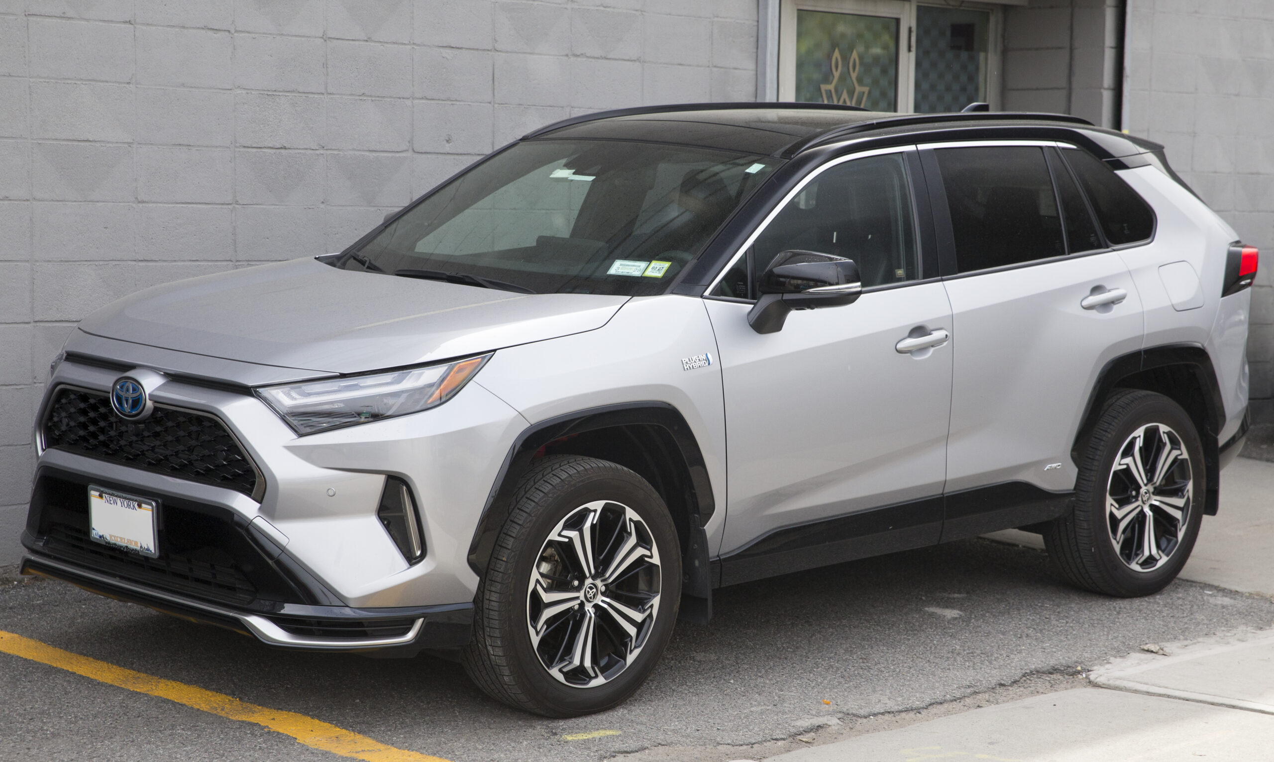 Toyota Safety Sense ADAS context shown with a 2024 Toyota RAV4 Prime XSE front three-quarter view.