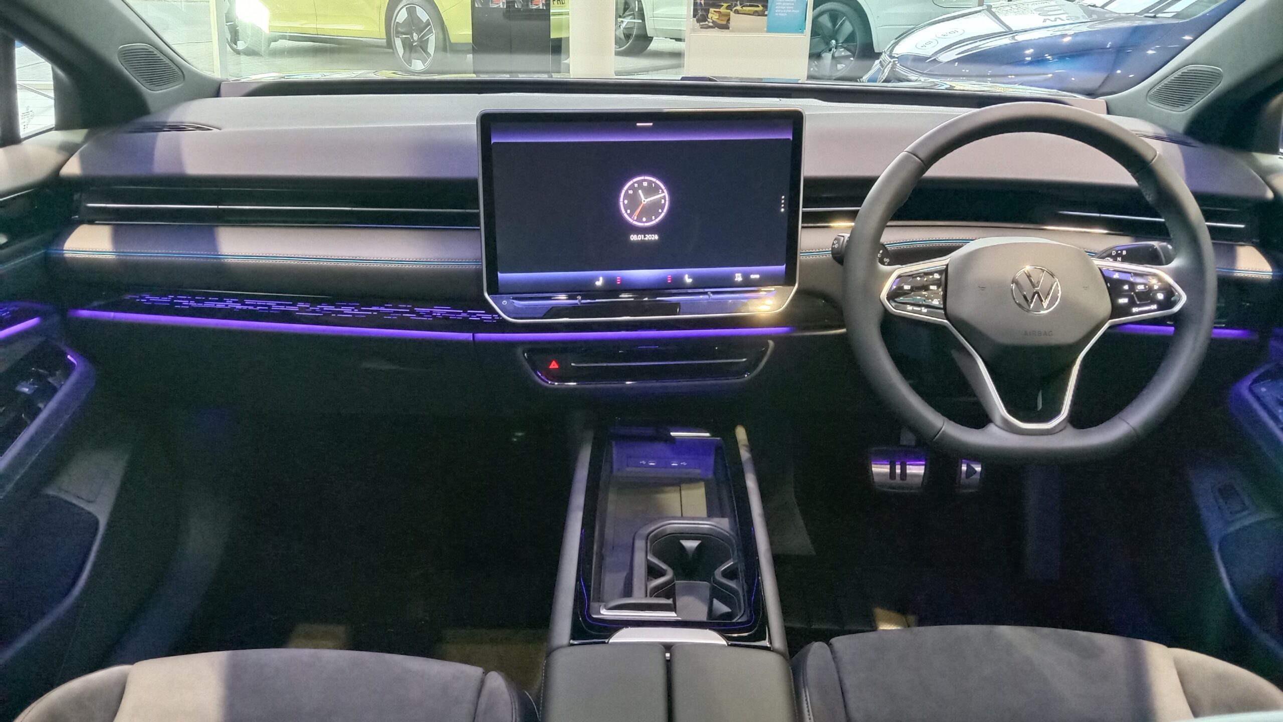 Volkswagen ID.7 interior showing the infotainment screen and driver interface.
