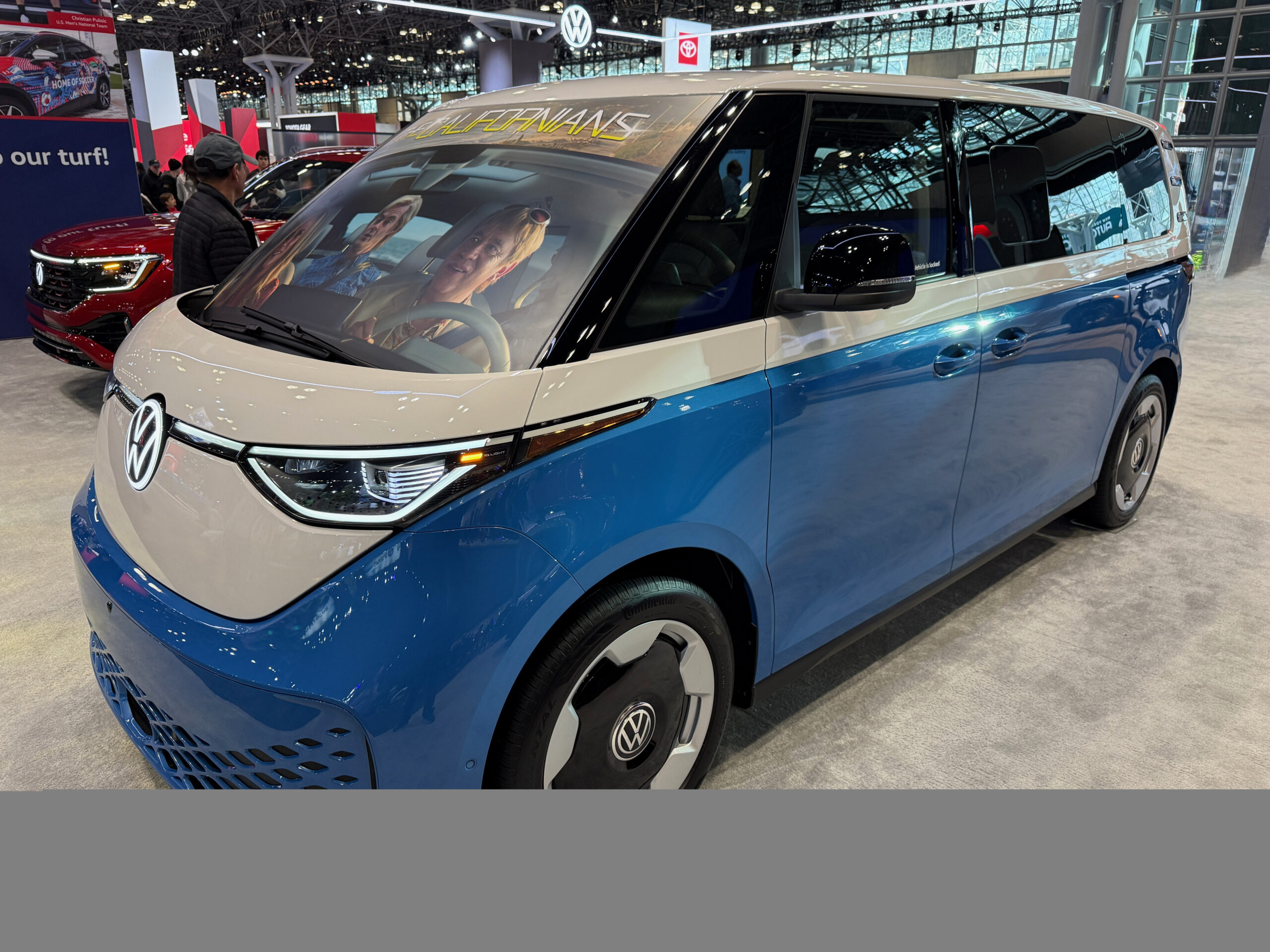 2025 Volkswagen ID. Buzz electric van photographed at an auto show.