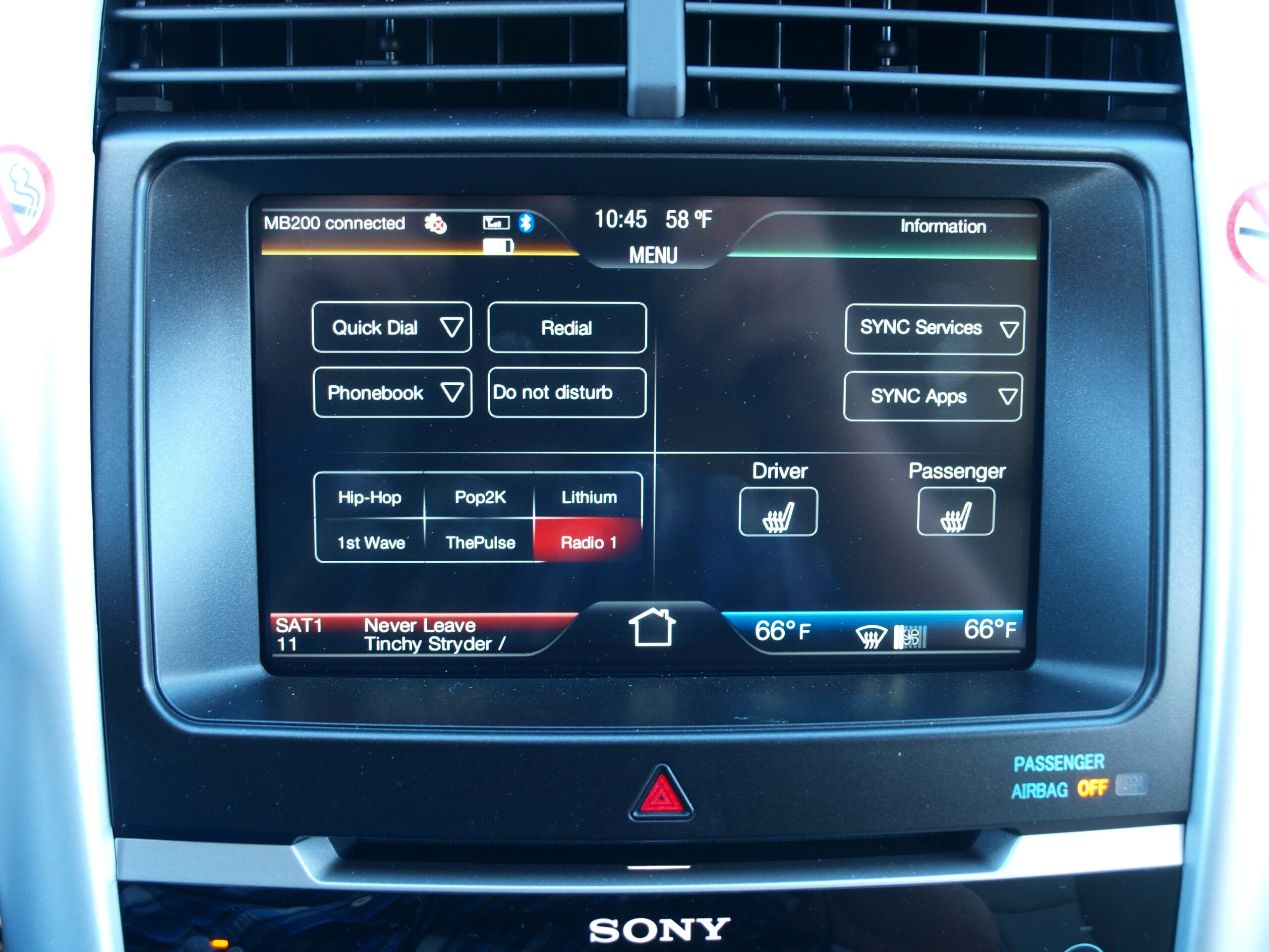 Car software issues shown through a Ford MyFord Touch infotainment screen in a vehicle dashboard.