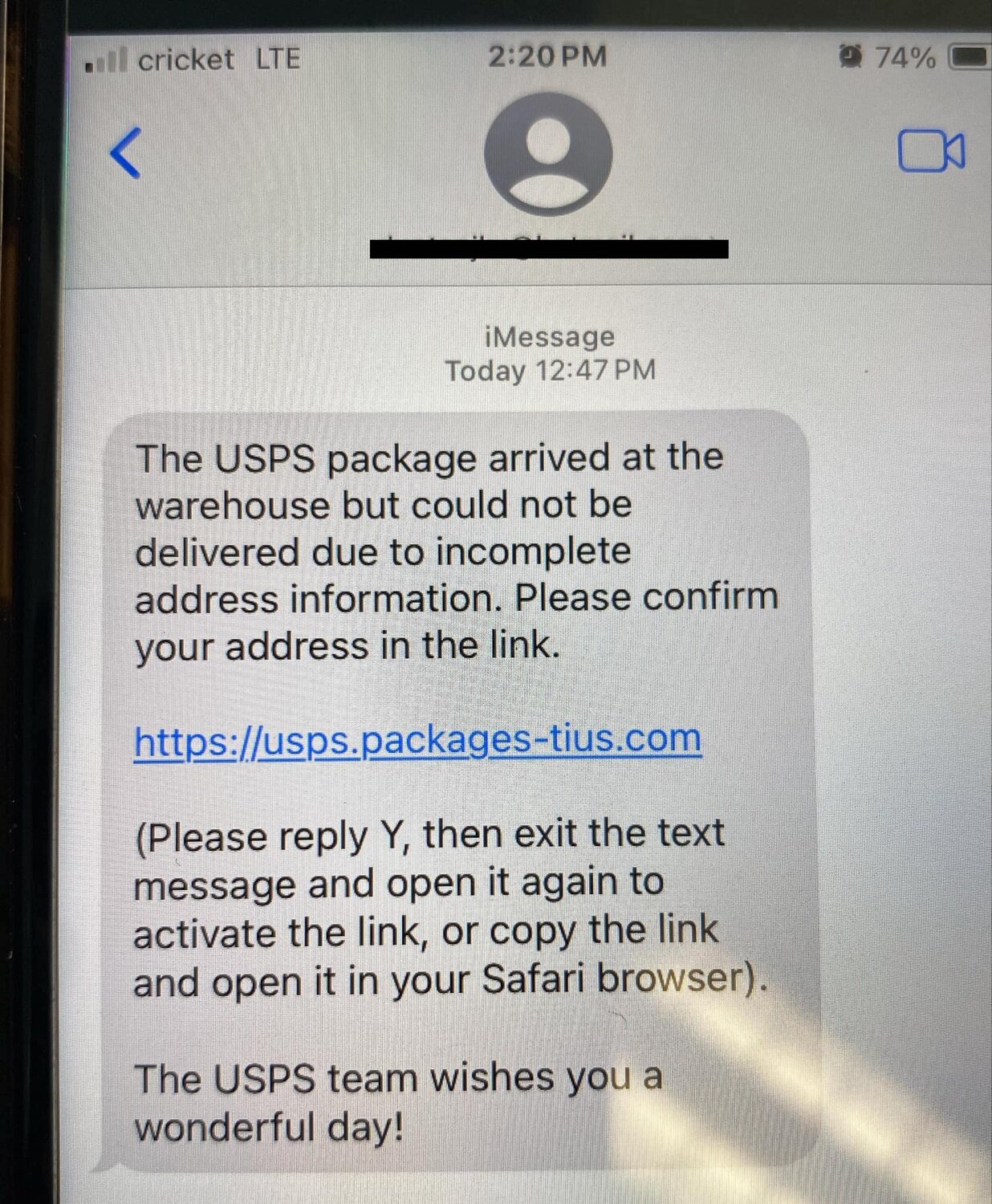 Package delivery scam text message shown on a smartphone screen
