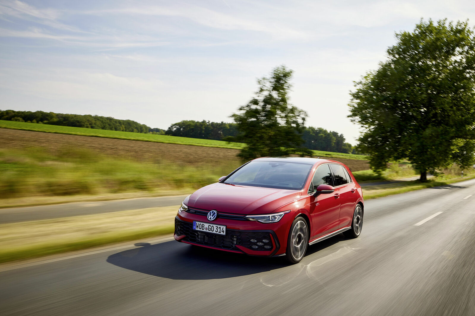 Volkswagen Golf GTI driving on a road in an official Volkswagen press photo
